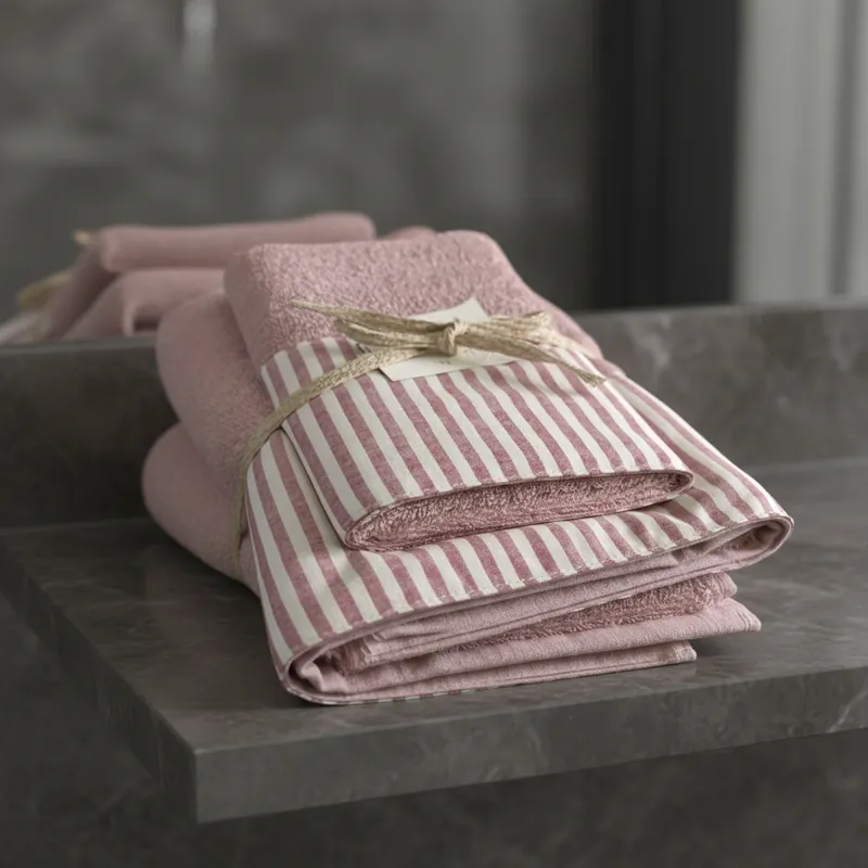 Set Asciugamani 1+1 viso e ospite in spugna con bordo a righe rosa