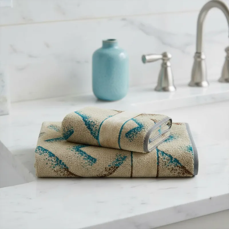 Set 1+1 Coppia di asciugamani Carrara Kanzi chevron turchese