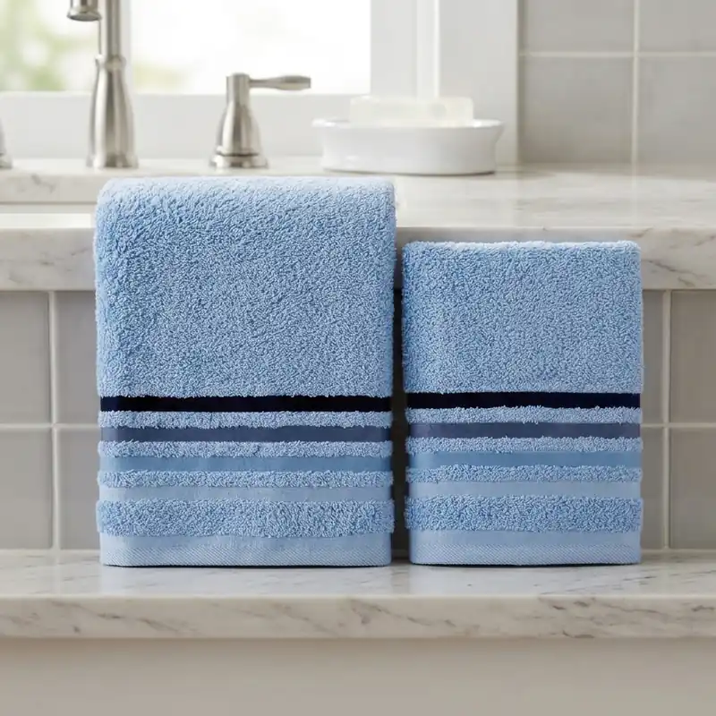Set asciugamani viso + ospite in spugna azzurro cielo con righe jacquard