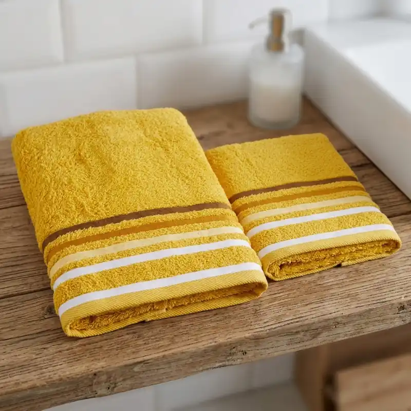 Coppia di asciugamani bagno viso+ospite senape con bordo a righe